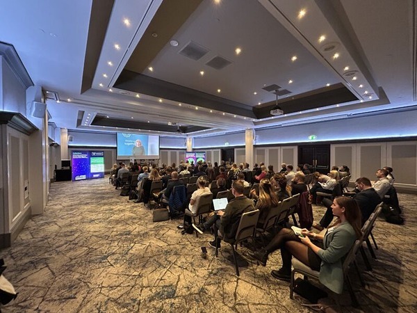 A conference hall full of people attending the Voicescape annual Customer Conference